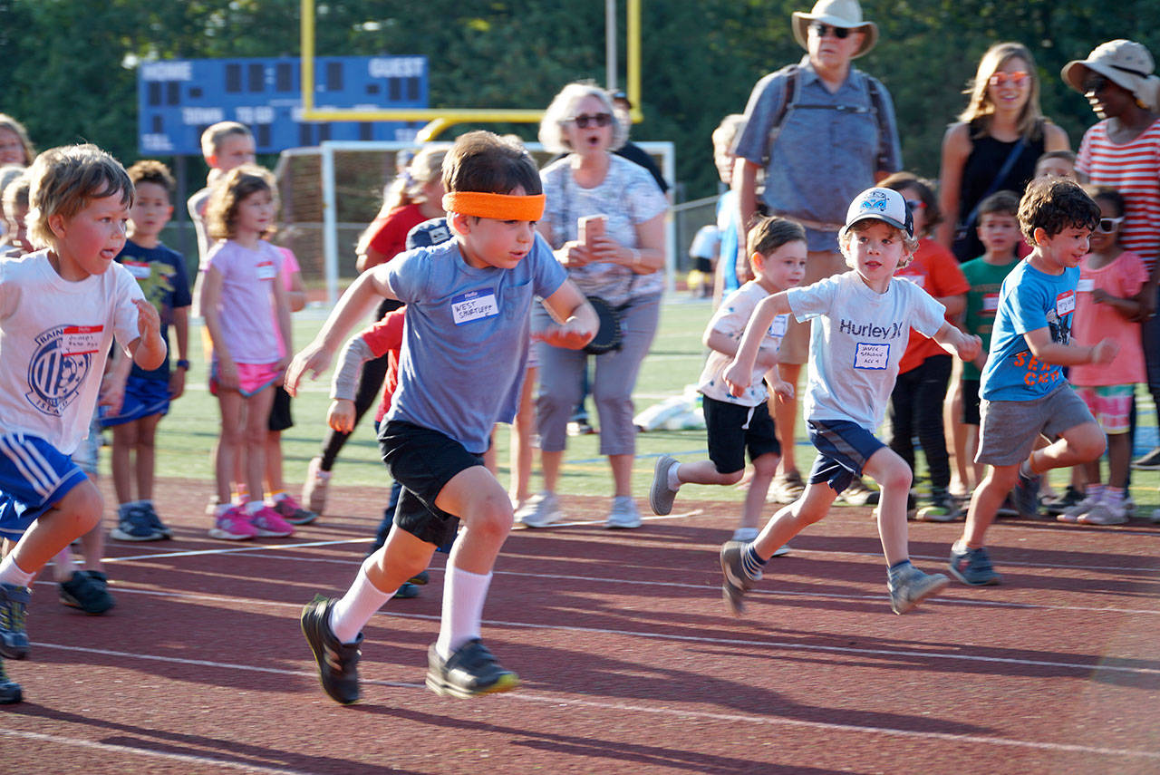 Luciano Marano | Bainbridge Island Review - West Schurtleff, 5, was rocking a sweet headband to help him beat the heat during Monday’s Kiwanis All-Comers Track Meet at Bainbridge High School. He ultimately came in first in his age group in three seperate events.