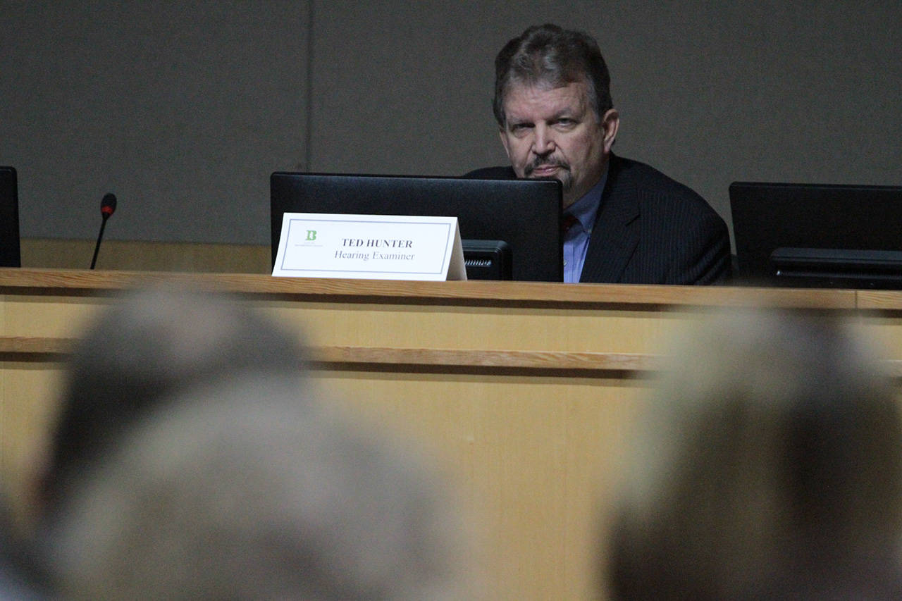 Bainbridge Island Hearing Examiner Ted Hunter opens the hearing on the Winslow Hotel proposal. (Brian Kelly | Bainbridge Island Review)