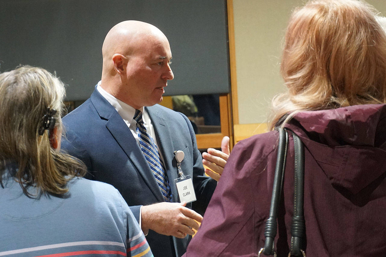 Joseph “Joe” Clark, former deputy police chief of the Norfolk Police Department in Norfolk, Virginia, talks to Bainbridge residents at a meet-and-greet in November. (Luciano Marano | Bainbridge Island Review)