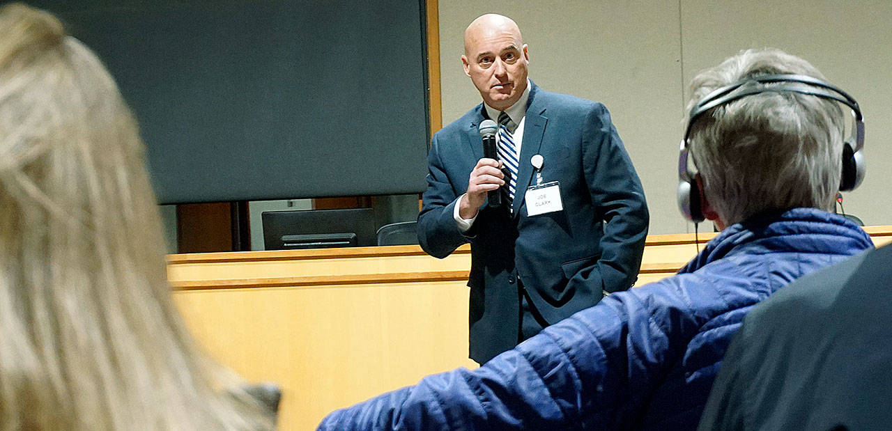 Joe Clark talks to Bainbridge residents during a meet-and-greet event for police chief finalists late last year at city hall. (Luciano Marano | Bainbridge Island Review)