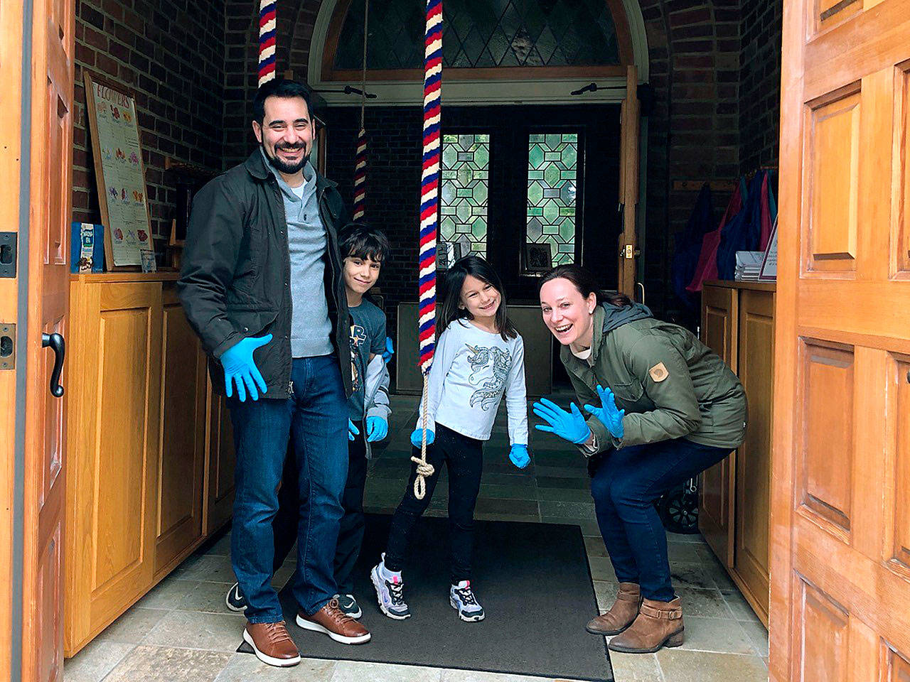 Dave and Karena Teves, and their children Kala and Kawika, ring the tower bells at St. Barnabas Episcopal Church to keep the Sunday morning tradition going. (Jim Friedrich photo)