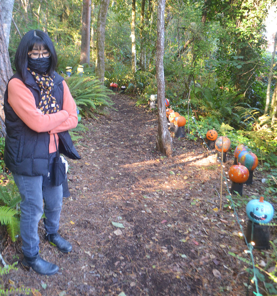 Donna Harui takes a walk along the Trail of Pumpkins. Steve Powell/Bainbridge Island Review photos