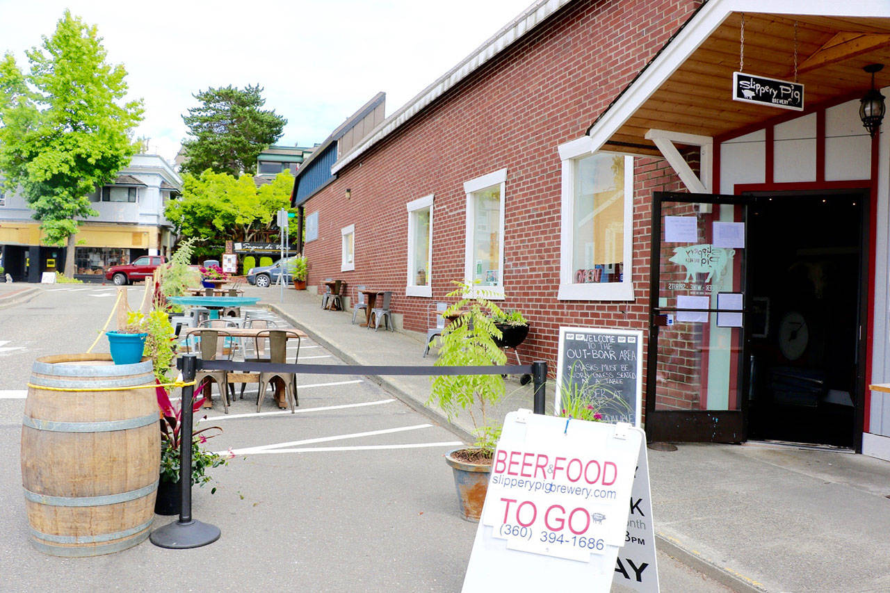 Outdoor seating, such as here at the Slippery Pig in Poulsbo, can still be used at restaurants. Ken Park/North Kitsap Herald photo