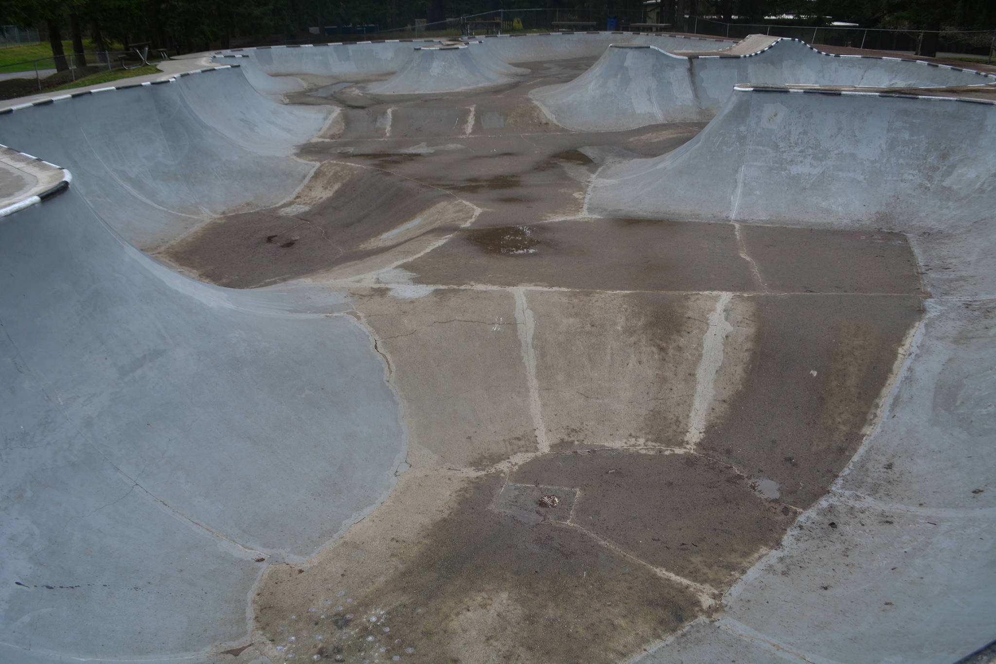 The skateboard park includes hills and valleys.