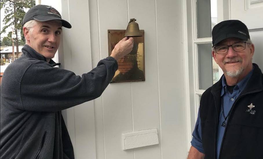 David Beemer, left, and Jim Macpherson have been ringing a smaller bell recently as the bigger one was broken. Courtesy photo