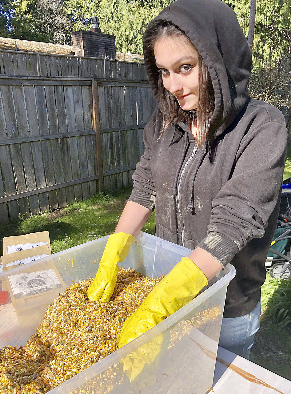 Saskia Burke mixing fowl treats. Courtesy Photo