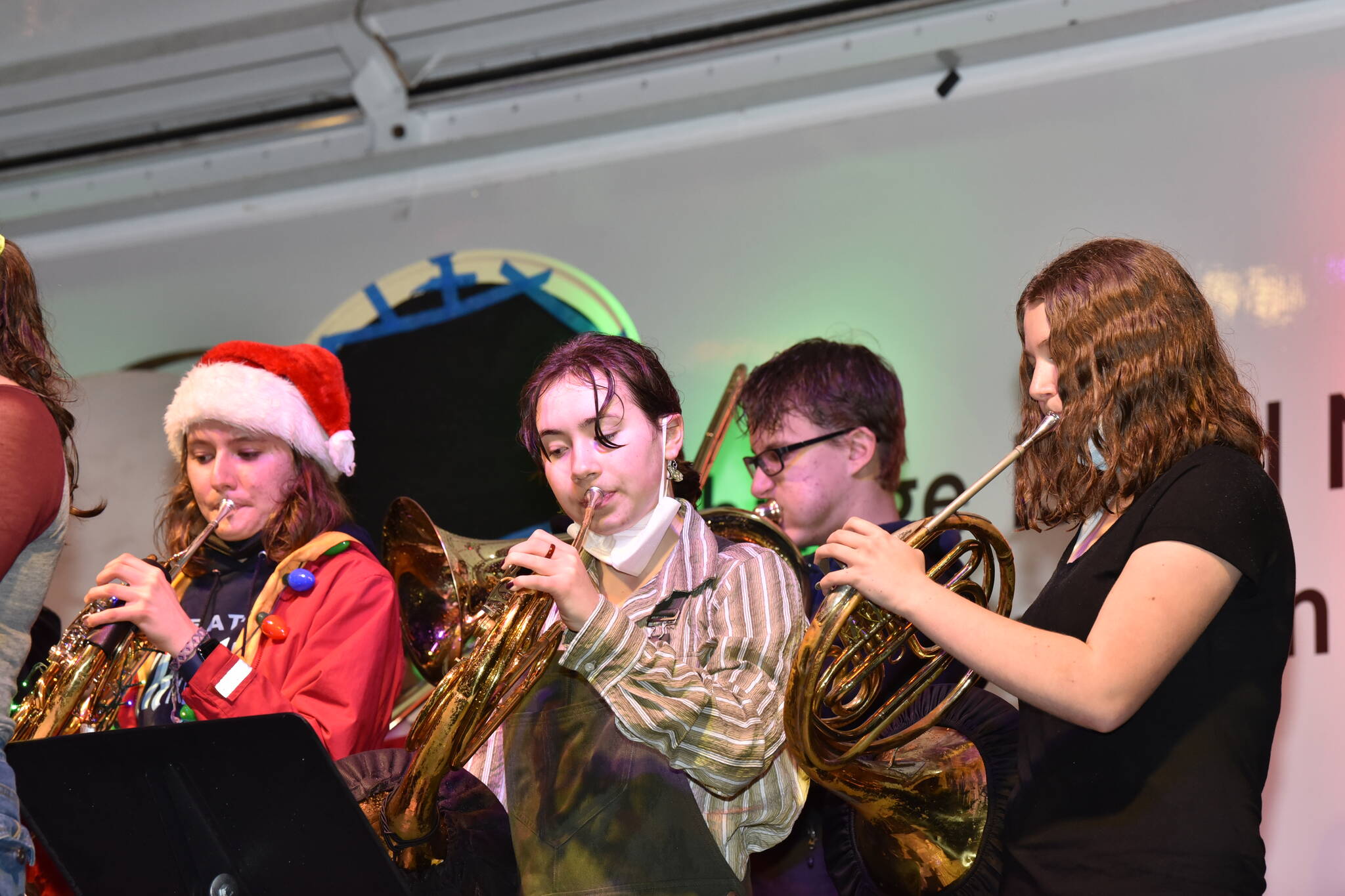 Three french horn players in the Bainbridge High School band.