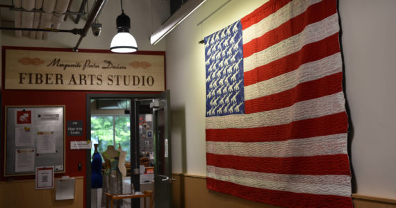 Naomi Spinak's Sweet Land of Liberty quilt is on display near the entrance of the Fiber Arts Studio at the BARN. Nancy Treder/Bainbridge Review