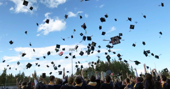 Caps fill the air at the end of commencement June 12 at BHS Memorial Stadium. Nancy Treder/Bainbridge Review photos