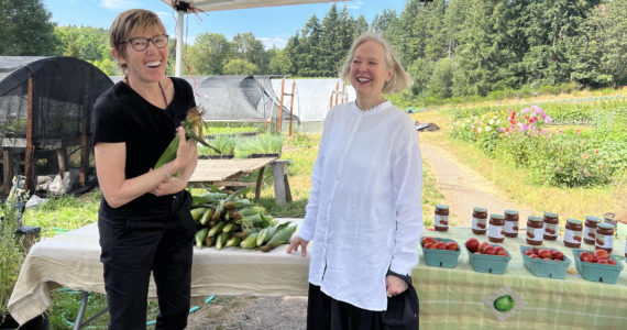 Nancy Treder/Bainbridge Island Review
Ann Strickland and Mary Anderson chat about how farmer Brian MacWhorter provided produce for people during the pandemic.