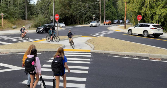 Students walk and cycle through the updated intersection at New Brooklyn and Sportsman Club roads on the morning of the first day of school Sept. 7. Nancy Treder/Bainbridge Island Review Photos