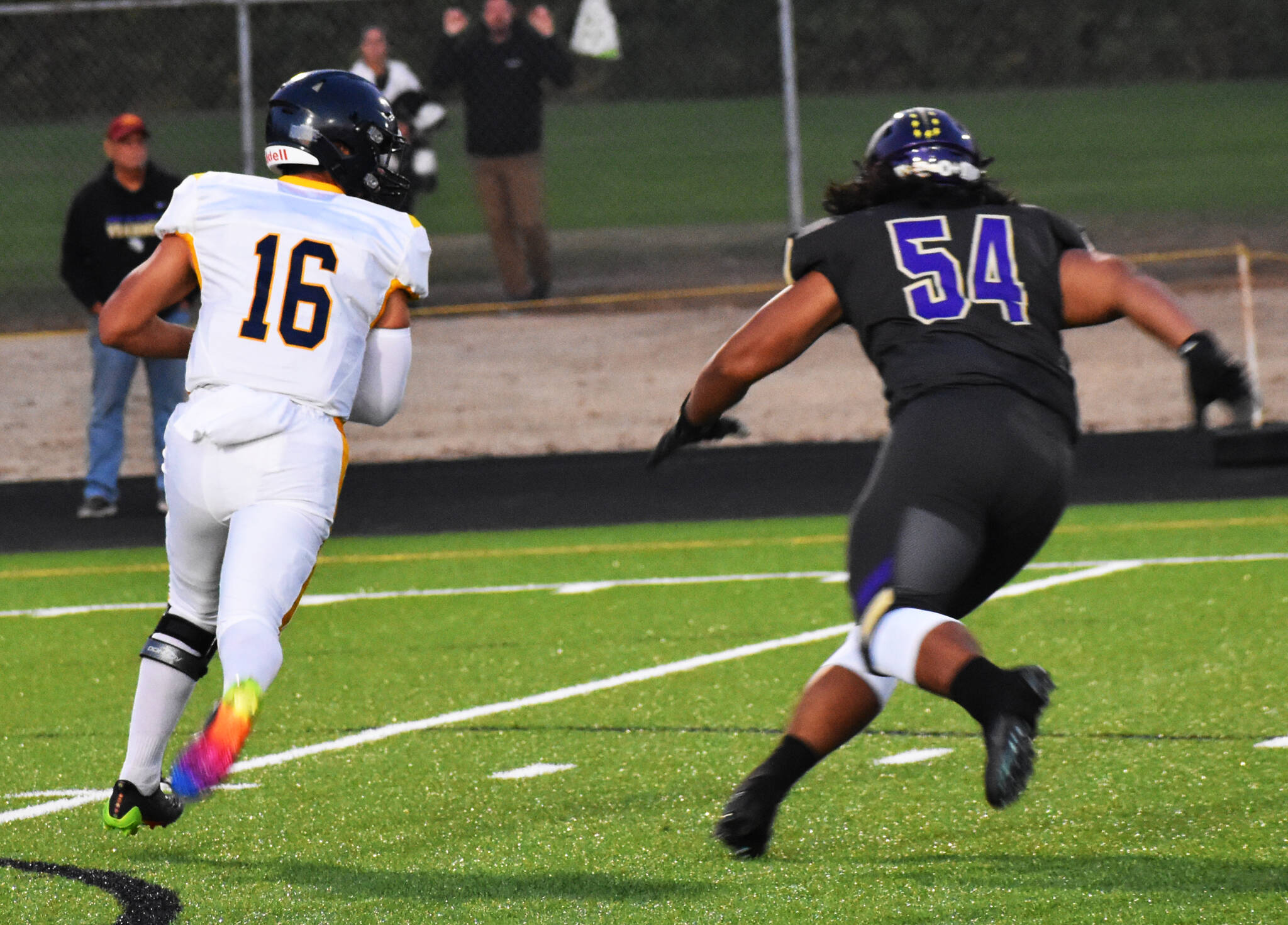 Bainbridge QB Jack Grant avoids the pressure in order to throw the ball downfield.