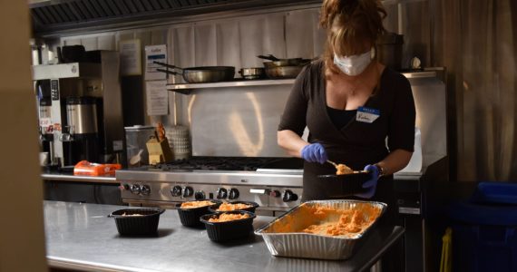 Kate O’Brien packages sweet potatoes prior to the holiday feast Nov. 24. Nancy Treder/Kitsap News Group Photos