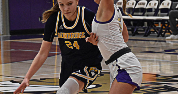 Bella Ramirez of the Spartans drives to the basket with NK’s Evelyn Beers guarding closely. Nicholas Zeller-Singh/Kitsap News Group Photos