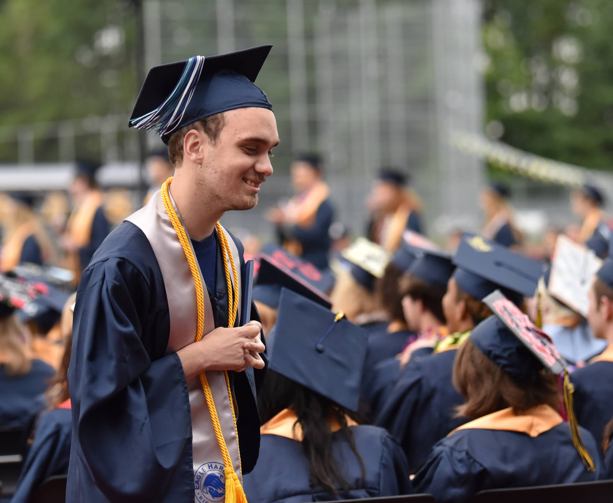 Eagle Harbor High School graduate Theodore Somers smiles after receiving his diploma.