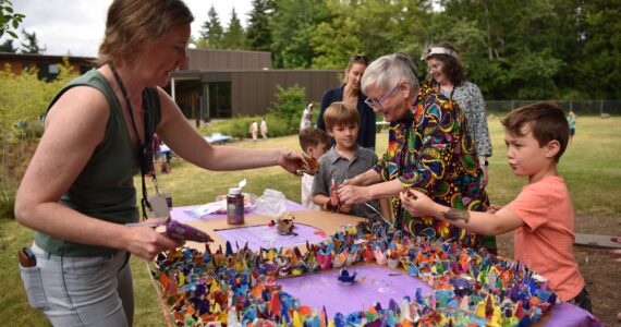 Blakely Elementary School kindergarten teachers Zoe Alder and Meghan Berg put together a large art piece made by students who painted egg carton cups that will be on display in the entry of the school. Nancy Treder/Kitsap News Group Photos