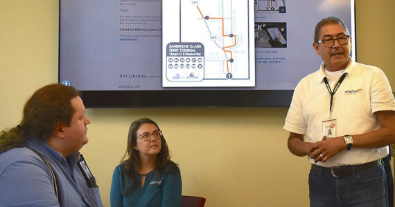 Nancy Treder/Kitsap News Group
Kitsap Transit employees share information at the commuter workshop June 22 at the Bainbridge Island Museum of Art for island employers.