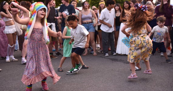 A crowd of dancers makes a circle for children during the Street Dance on Winslow Way July 3. Nancy Treder/Kitsap News Group Photos