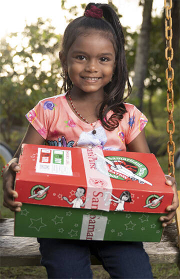 Samaritan’s Purse courtesy photo
A child receives a shoebox filled with school supplies.