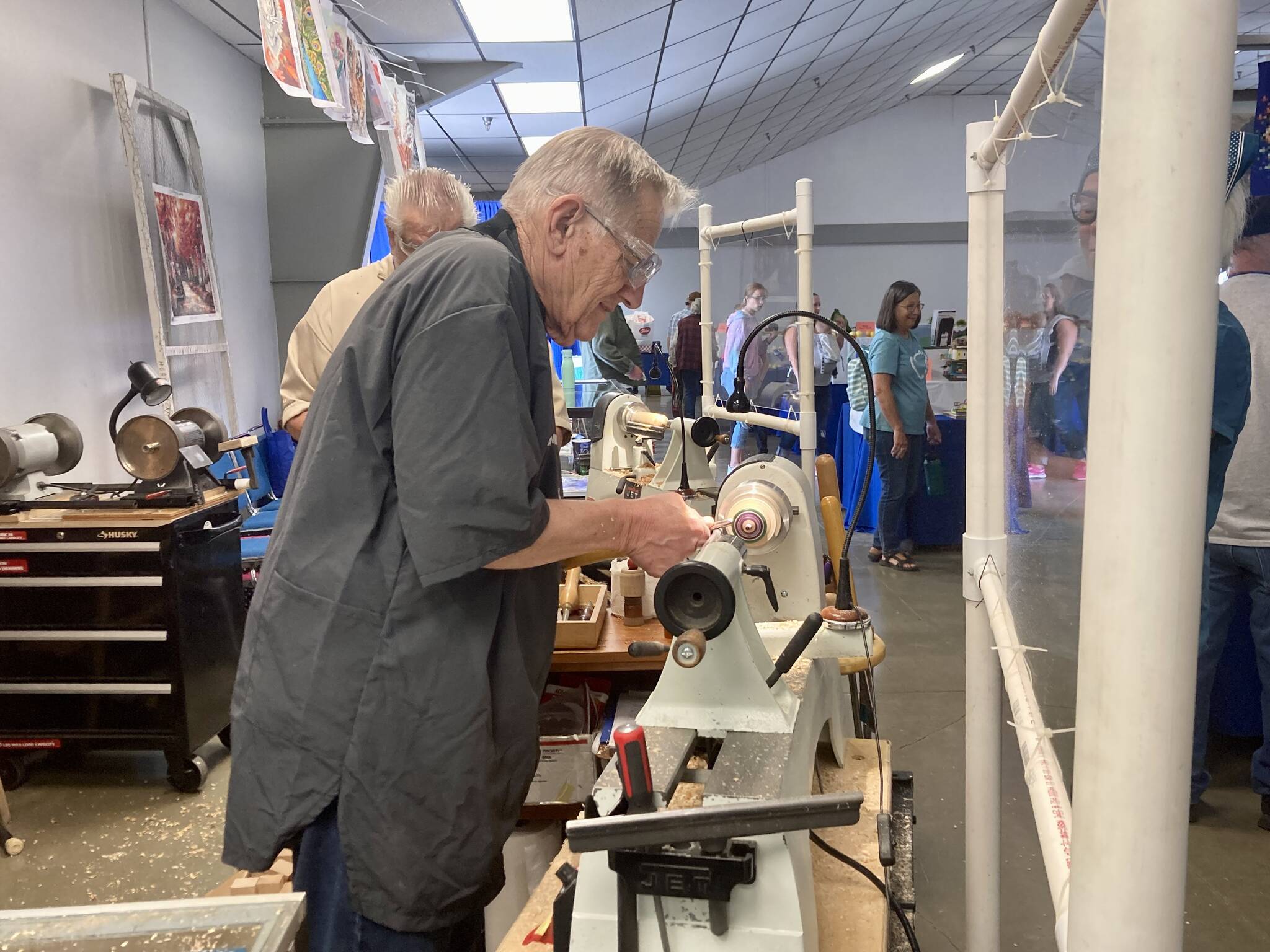 Passersby can check out a live demonstration at the Olympic Peninsula Woodturners table.