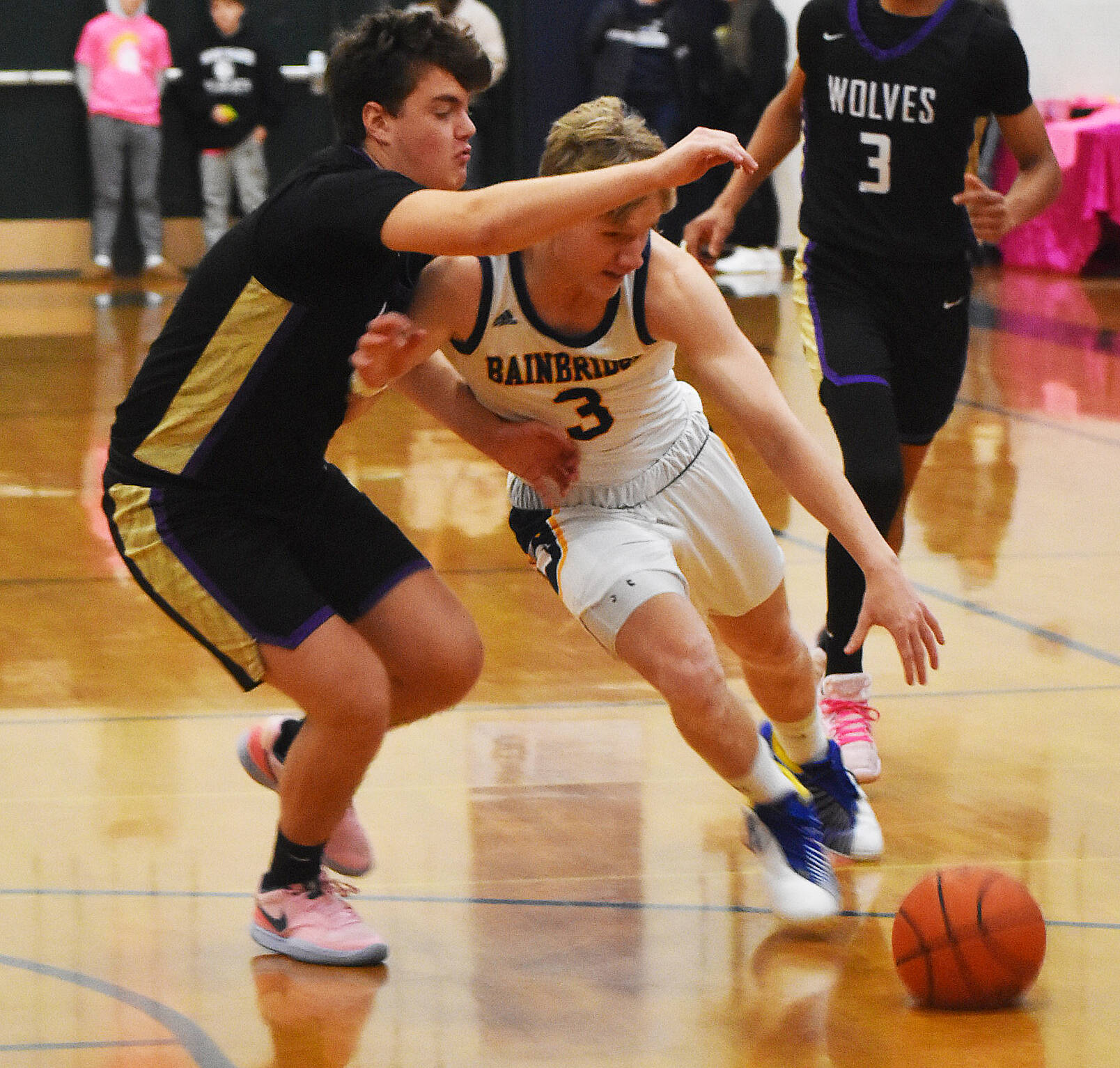 Sam Nylund drives past the Sequim defender.