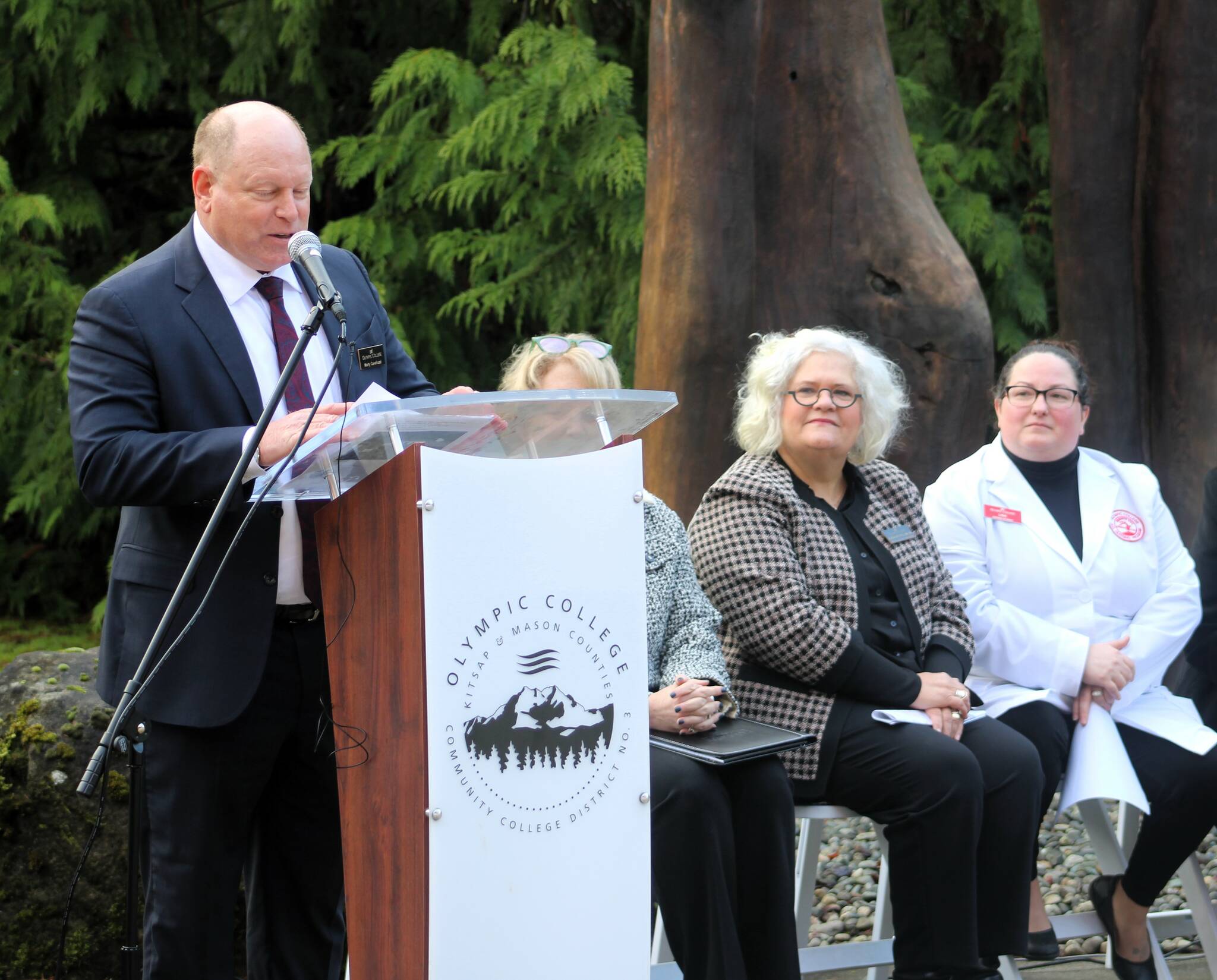 Olympic College president Marty Cavalluzzi announces the amounts of funding obtained in partnerships with the county and VMFH for an expansion in the school’s healthcare education.