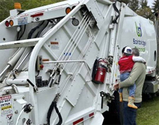 Kids always enjoy looking at the big rigs used to clean up the environment.