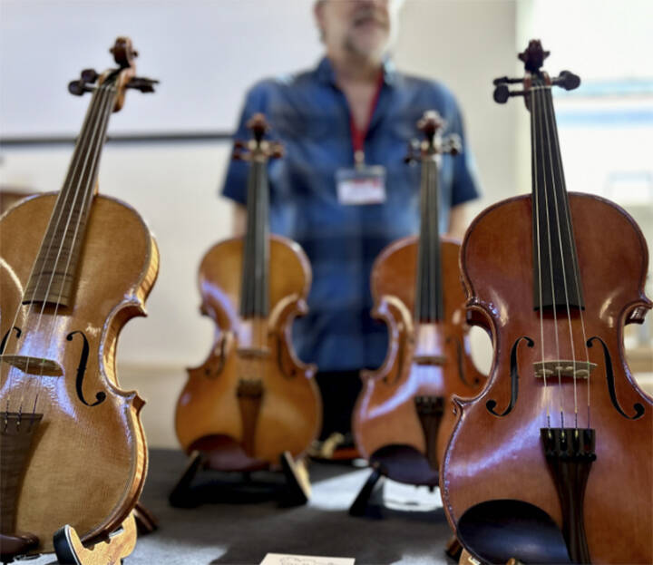 Handmade violins were sold at the event.