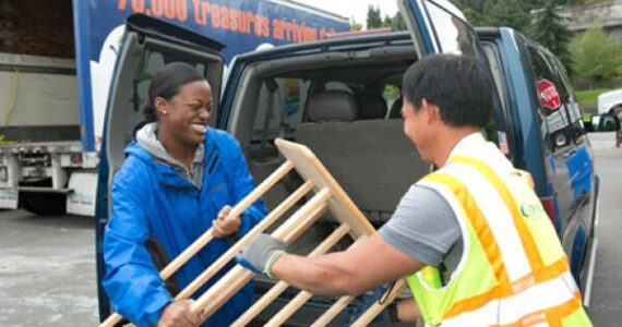 Evergreen Goodwill courtesy photo
A Goodwill employee assists a customer with a large donation at the Bainbridge Island Donation Center.