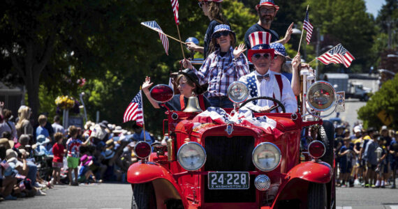 Jonathan Palmer courtesy photos
Uncle Sam drives an antique vehicle packed with folks in July 4 regalia in front of the many visitors who attended the Grand Old 4th of July in Bainbridge Island Thursday.