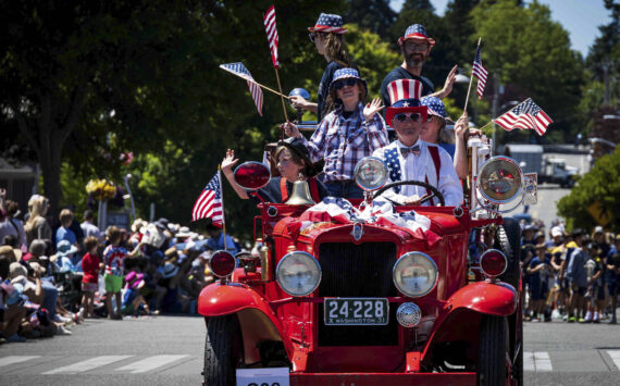 Jonathan Palmer courtesy photos
Uncle Sam drives an antique vehicle packed with folks in July 4 regalia in front of the many visitors who attended the Grand Old 4th of July in Bainbridge Island Thursday.