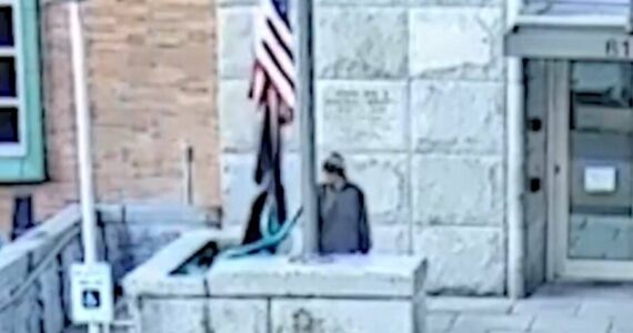 KCSO courtesy photo
Footage from security cameras around the Kitsap County Superior Court in Port Orchard shows an alleged suspect stealing the American flag from the outside flag pole.