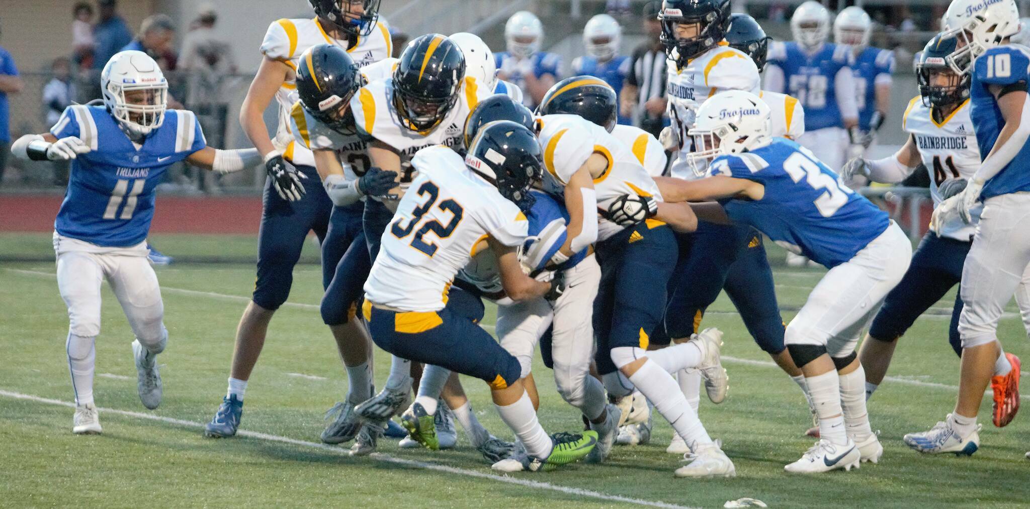 File photo
A swarm of Spartans wrap up the ball carrier in a 45-3 victory over Olympic in 2023.