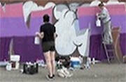 Students work on the mural.