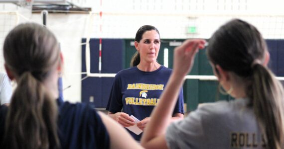 Elisha Meyer/Kitsap News Group photos
Bainbridge High volleyball coach Holly Rohrbacher brings her players together for a talk before practice in the first week of the new fall season.