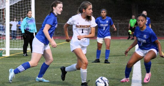 Elisha Meyer/Kitsap News Group photos
Bainbridge freshman Vega Hendrickson tries to find a teammate near the goal of the Olympic Trojans.