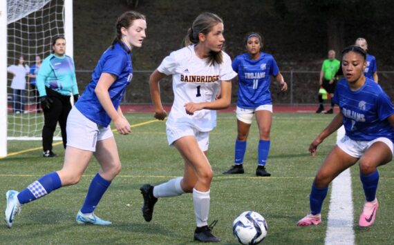 Elisha Meyer/Kitsap News Group photos
Bainbridge freshman Vega Hendrickson tries to find a teammate near the goal of the Olympic Trojans.