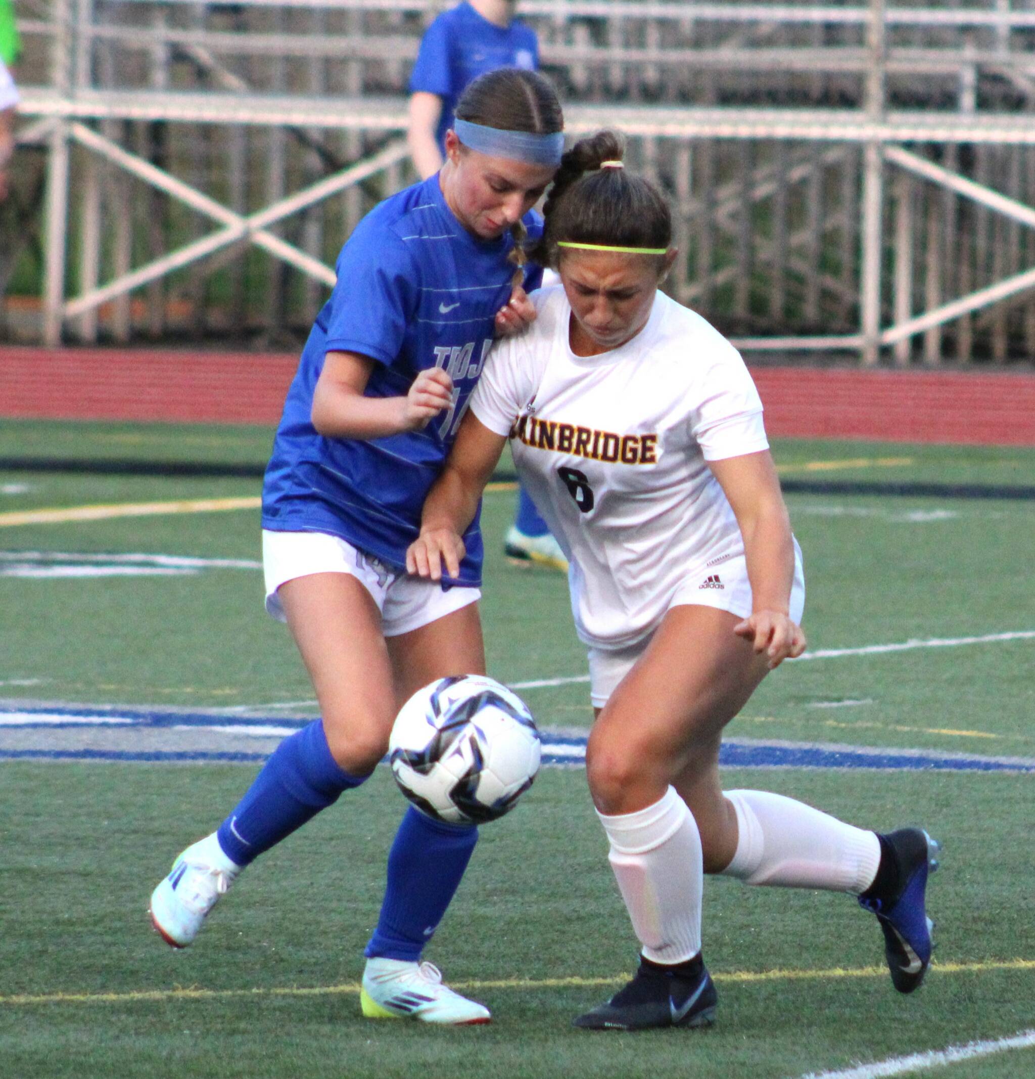 Bainbridge senior Sophia Weindl fights for possession in the first half of a match against Olympic.