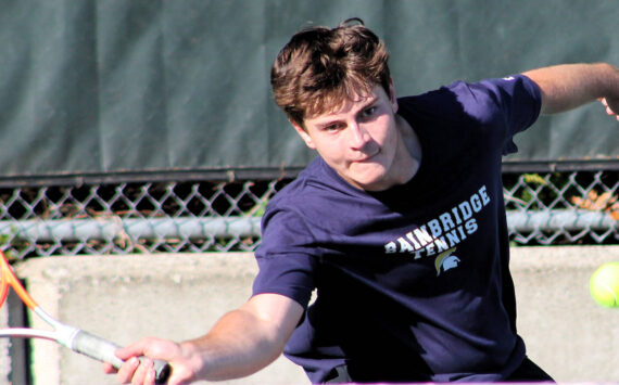 Elisha Meyer/Kitsap News Group photos
Garner Hall reaches out to catch the path of a bouncing tennis ball in a singles match.