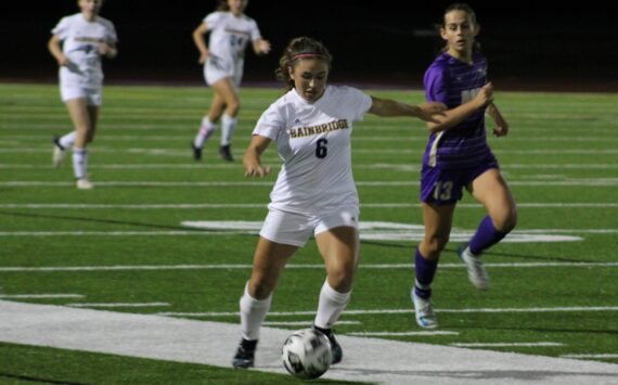 Elisha Meyer/Kitsap News Group
Bainbridge senior Sophia Weindi shoots a pass downfield in overtime against the Vikings.