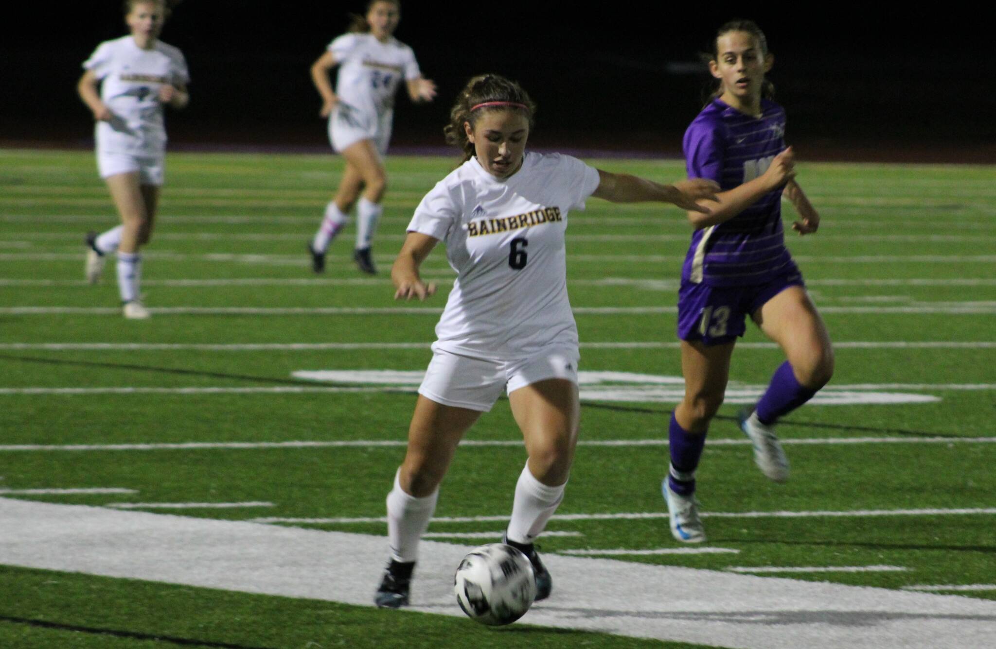 Elisha Meyer/Kitsap News Group
Bainbridge senior Sophia Weindi shoots a pass downfield in overtime against the Vikings.