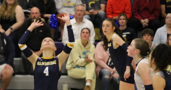 Elisha Meyer/Kitsap News Group photos
A line of Spartan attackers prepare to approach the net as senior setter Lola Batcheller gets underneath the ball.