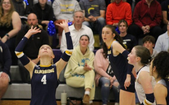 Elisha Meyer/Kitsap News Group photos
A line of Spartan attackers prepare to approach the net as senior setter Lola Batcheller gets underneath the ball.