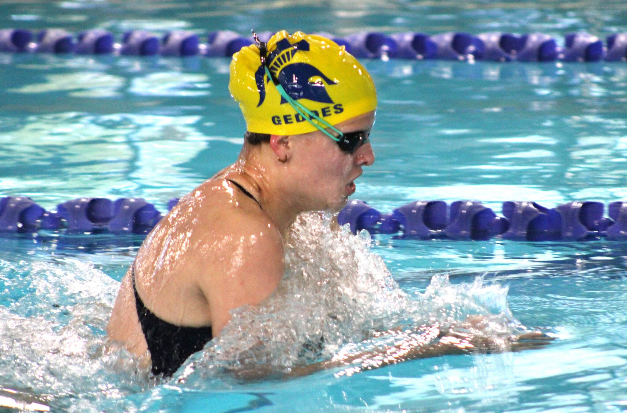 Spartan senior Maya Geddes makes her way to the finish in the 100 breaststroke.