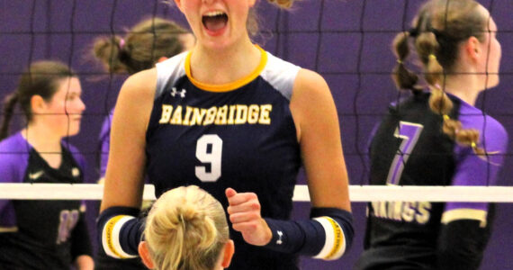 Elisha Meyer/Kitsap News Group
Senior outside hitter Holley McFadden celebrates with senior teammate Lola Batcheller after a Spartan point versus the North Kitsap Vikings.