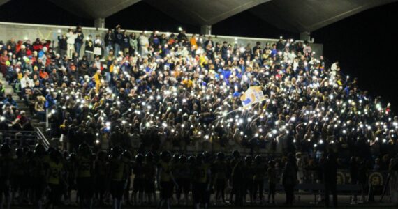 Elisha Meyer/Kitsap News Group photos
The Bainbridge High School student section helps illuminate the night in the first of two light outage delays in an Oct. 18 gave vs. North Kitsap.