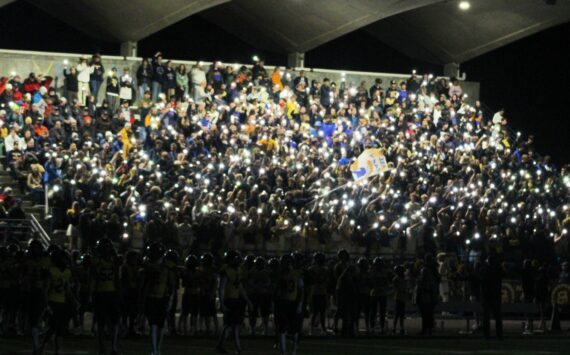 Elisha Meyer/Kitsap News Group photos
The Bainbridge High School student section helps illuminate the night in the first of two light outage delays in an Oct. 18 gave vs. North Kitsap.