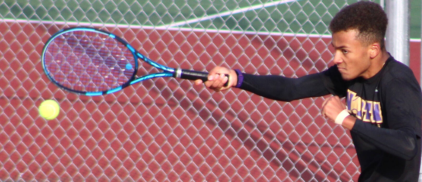 North Kitsap’s Dayshawn Harper connects with a forehand in a league semifinal match.