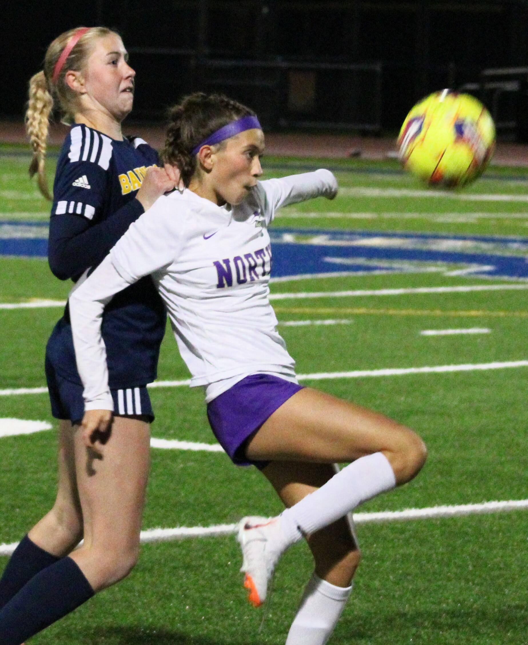 Viking freshman Vianny Garcia Deluna battles for the ball with BHS senior Arden De Lanoy.