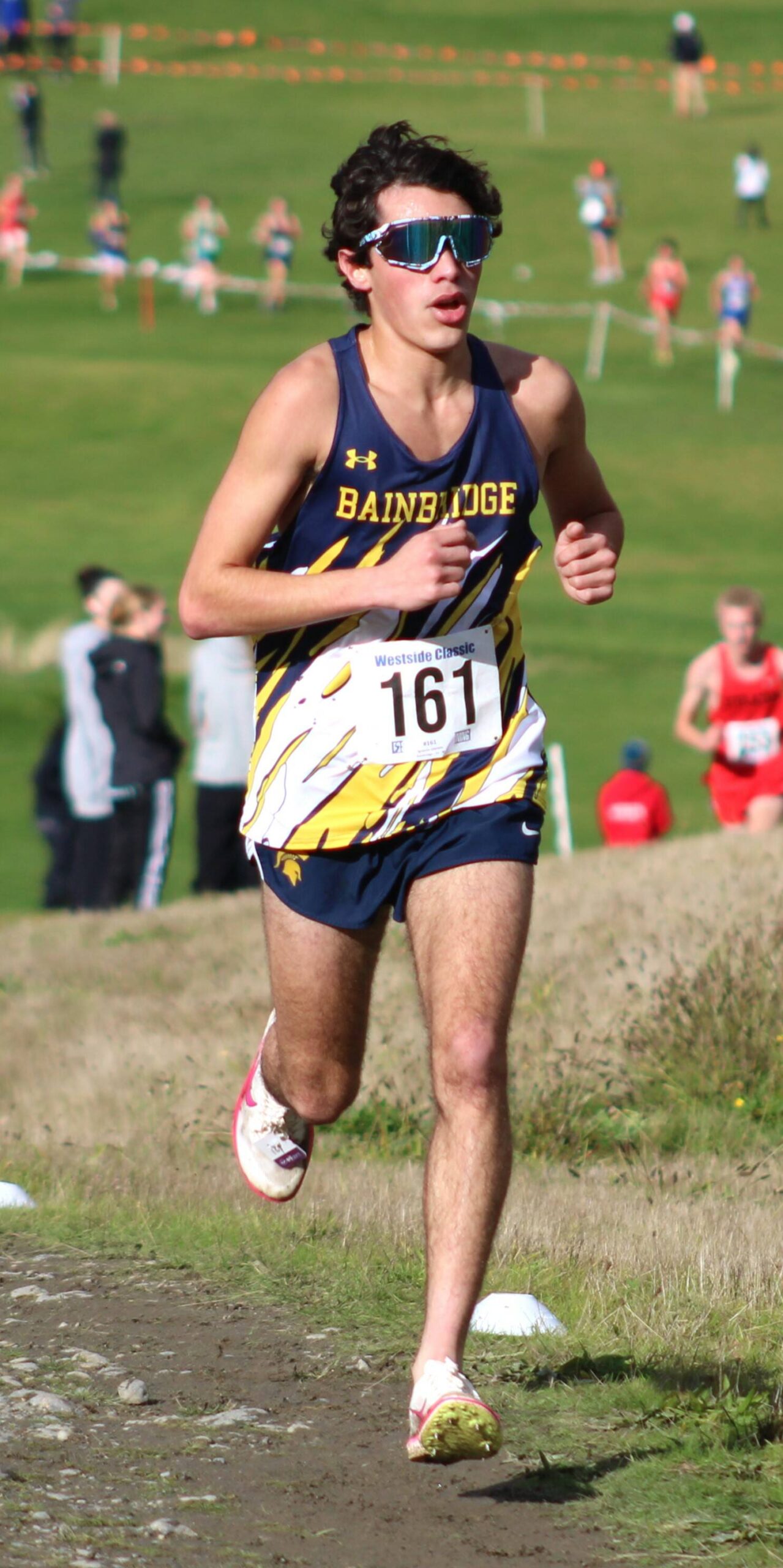 Bainbridge junior Ignacio Llorens conquers a steep hill in the second lap of his 2A district race.